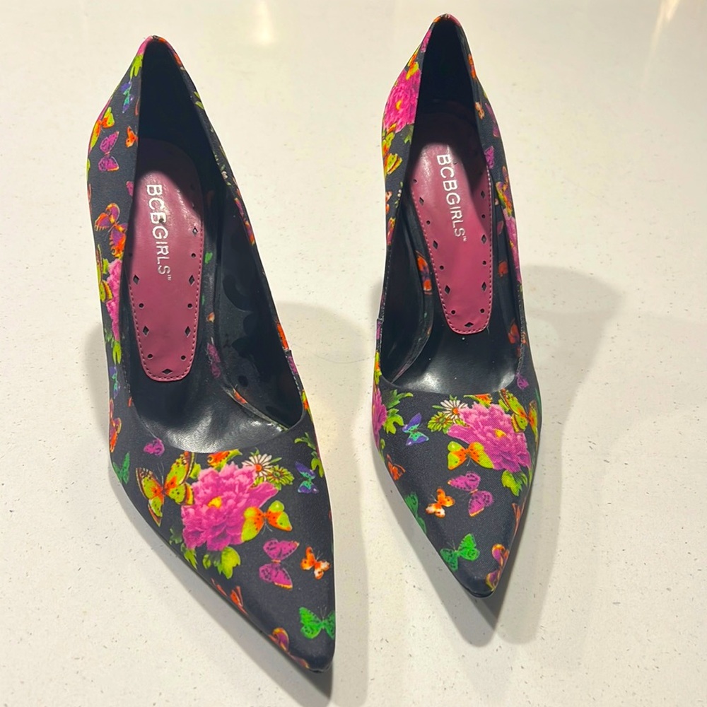 BCBGirls size 7.5 black butterfly heels. Worn once and in excellent condition.